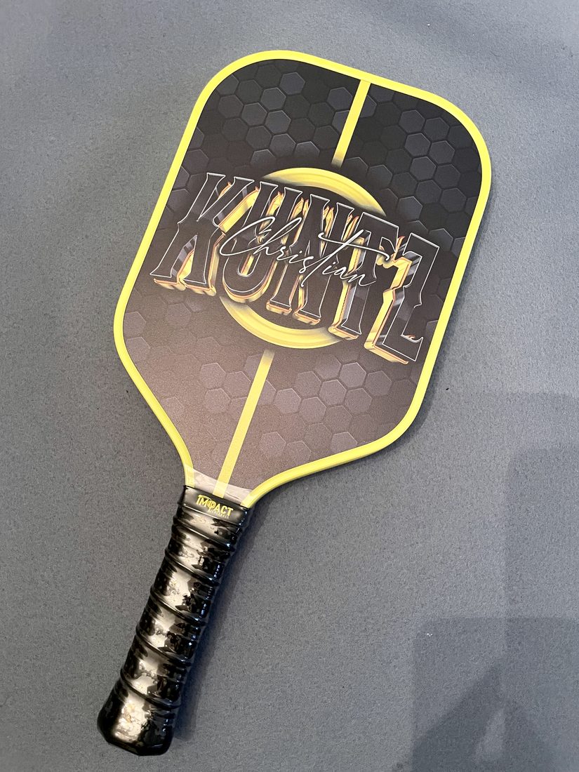Christian Kuntz signature paddle with iMPACT grip band