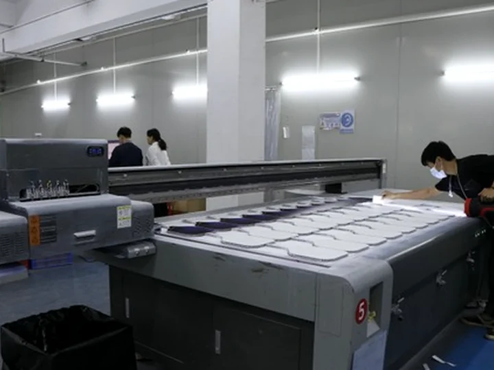 The production floor where paddle faces are printed and finished